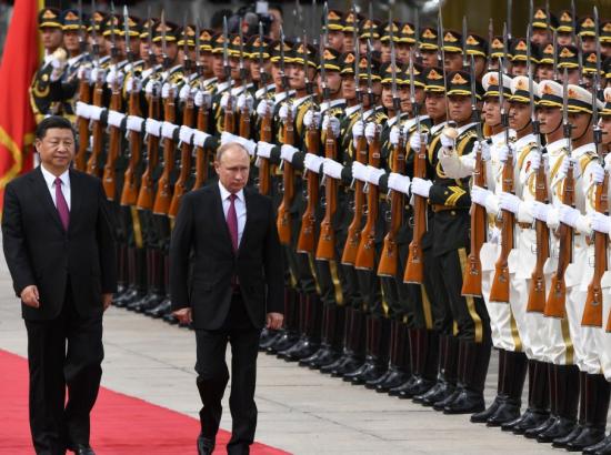 Xi Jinping and Vladimir Putin attend a welcome ceremony in Beijing, China. June 8, 2018