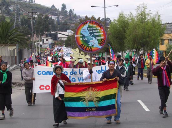 CONAIE march with flag in Quito, Ecuador