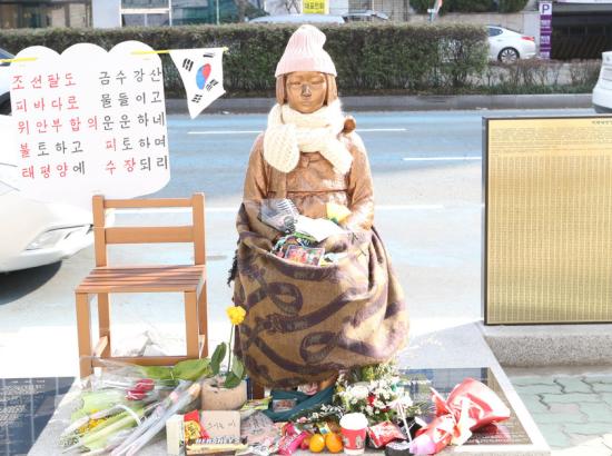 comfort woman statue outside the Japanese consulate in Busan, South Korea