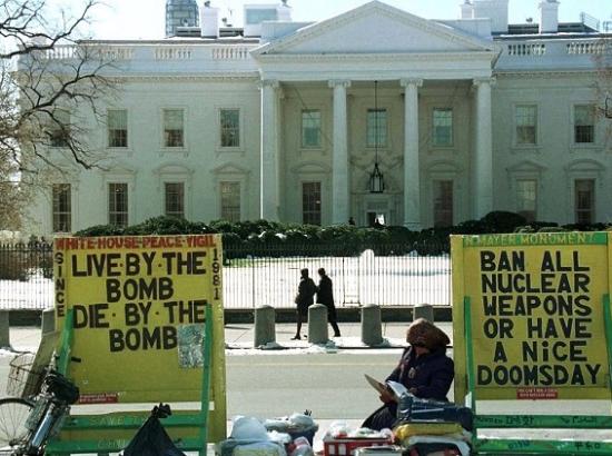 "live by the bomb - die by the bomb" - White House protest sign