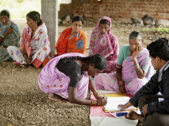 women participate in self-help group, India