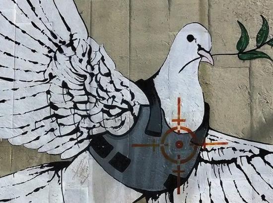 Bansky mural painting in Bethlehem -- Armored Dove of Peace