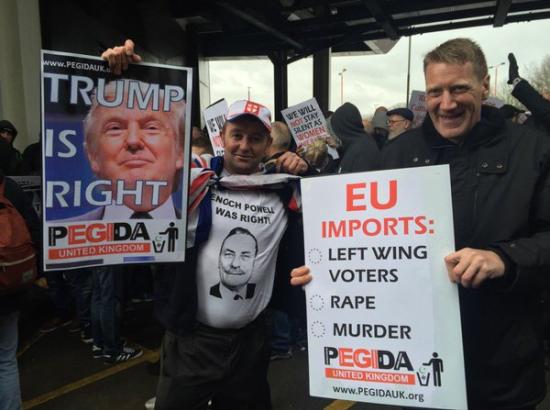 PEGIDA supporters hold up 'Trump is Right' sign at march