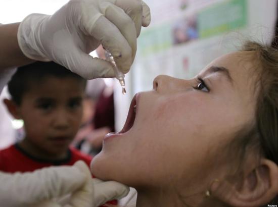 a child is administered an oral polio vaccination 