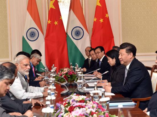 Indian Prime Minister Narendra Modi meets President Xi Jinping of China on the sidelines of the 2016 SCO Meeting in Tashkent.