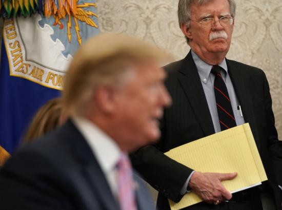 John Bolton listens to Trump in the Oval Office, April 2019