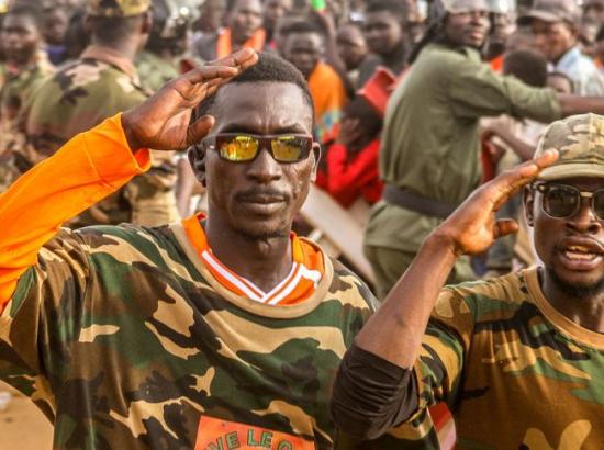 Niger's military-government supporters take part in a demonstration in front of a French army base in the capital Niamey