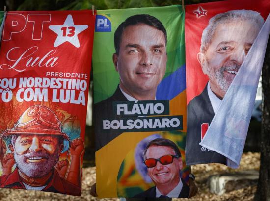 Towels and caps for sale depicting Brazilian presidential candidates Luiz Inacio Lula da Silva and Flavio Bolsonaro are seen in a residential area of Brasília on September 11, 2026. Brazil will hold a presidential elections on October 4, 2026. Sergio Lima/AFP via Getty Images