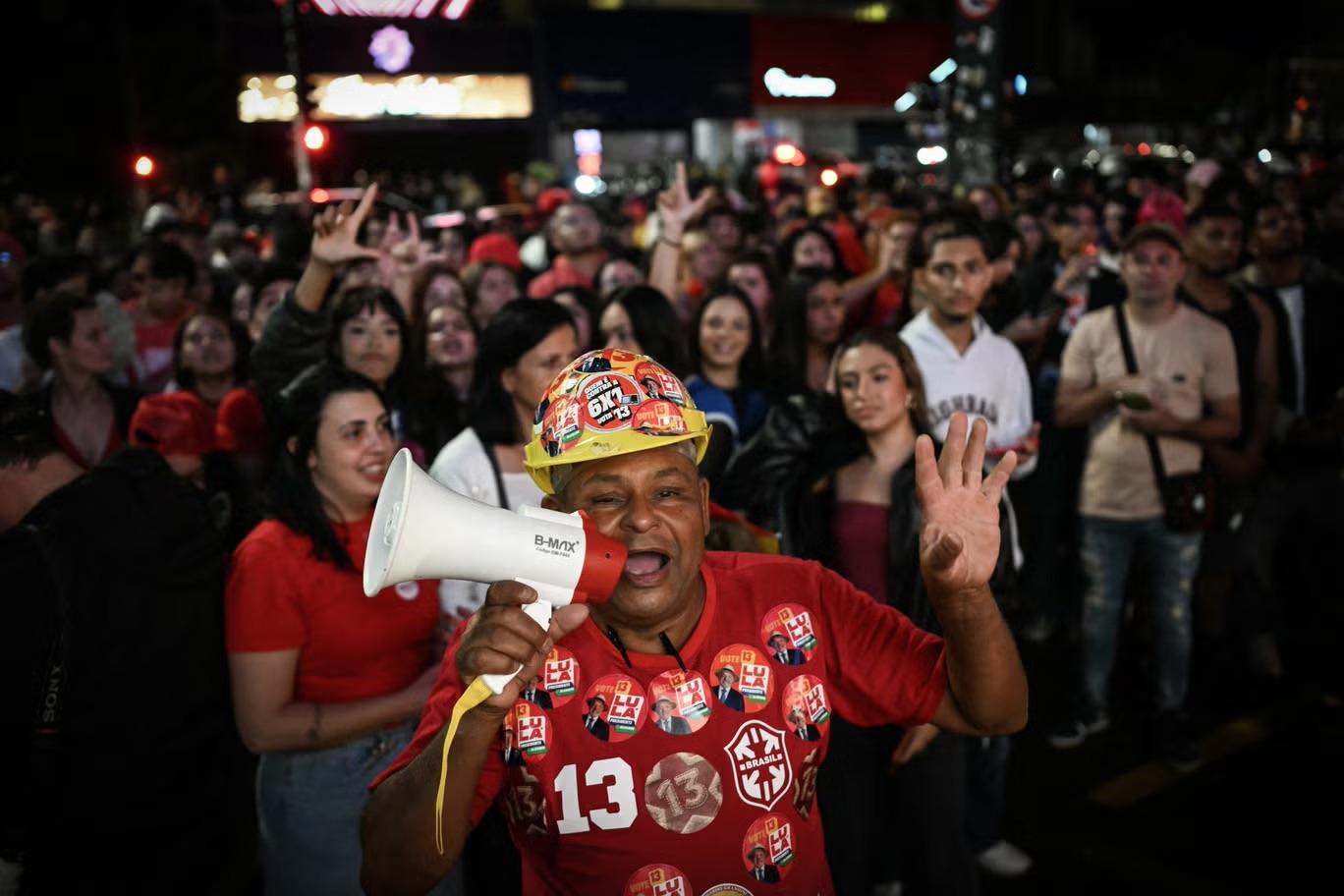 Supporters of Brazil's president Luiz Inacio Lula da Silva react after the first results of the presidential election in Sao Paulo, Brazil, on 4 October 2026 (AFP/Getty)