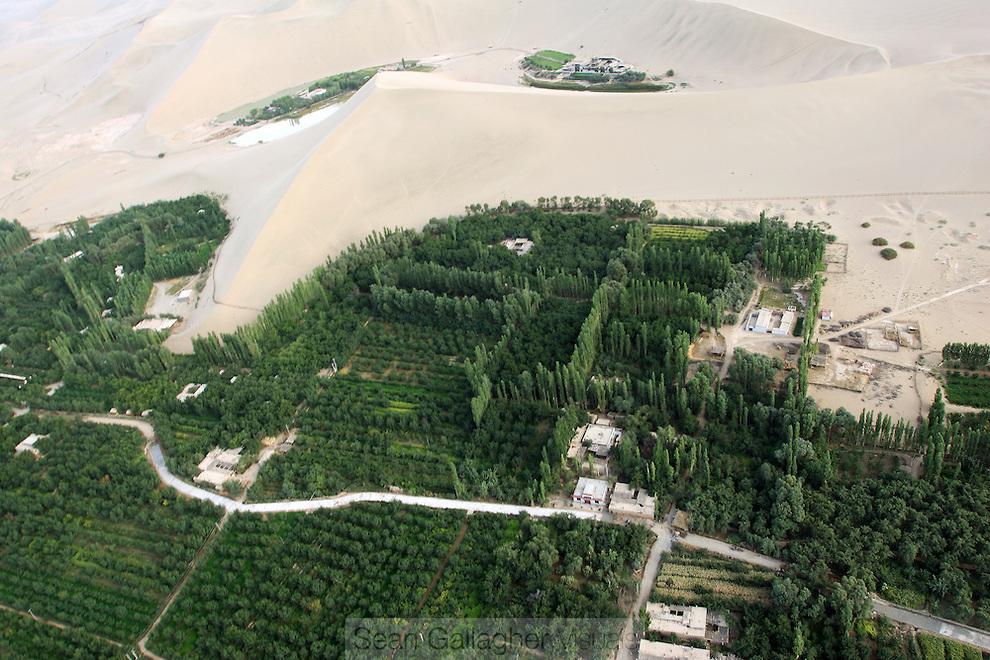 photo: desertification, sand dunes inundating agricultural land in China