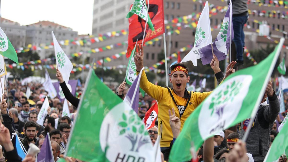 People wave HDP flags at gathering March 2019