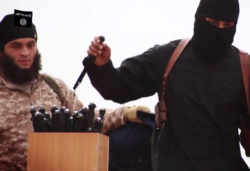 "Jihad John" Mohammed Emwazi reaching from a box of knives