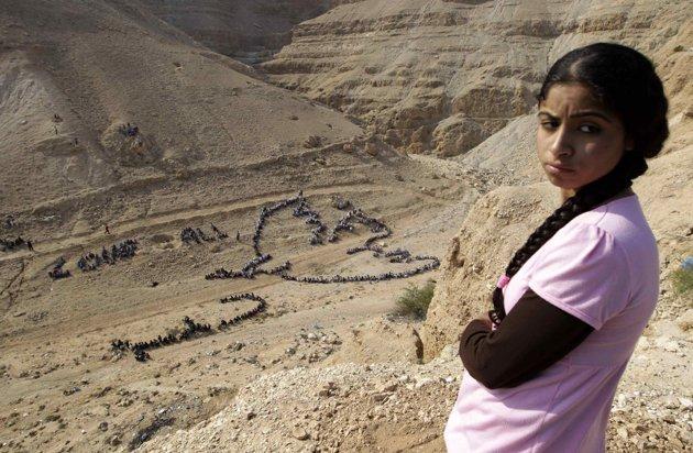 1000 Palestinian children form Pablo Picasso’s Dove of Peace near Jericho in West Bank.