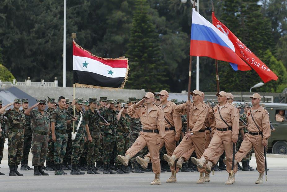 Russian and Syrian soldiers during a rehearsal for a military parade at Hmeimim airbase, Latakia, Syria 