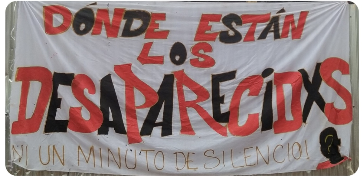 A photograph of the banner at the monthly meeting asks: Where are the Disappeared?. Photo by Fundación Guagua, used with permission