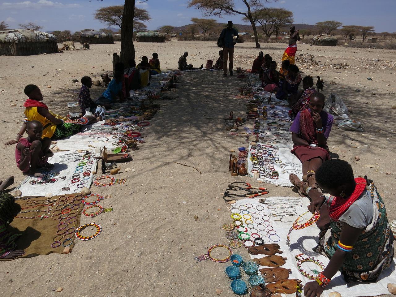 Samburu women selling crafts in a "traditional village" (photo credit: the author)