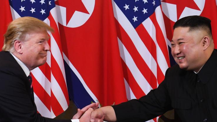 Donald Trump and Kim Jong-un shake hands