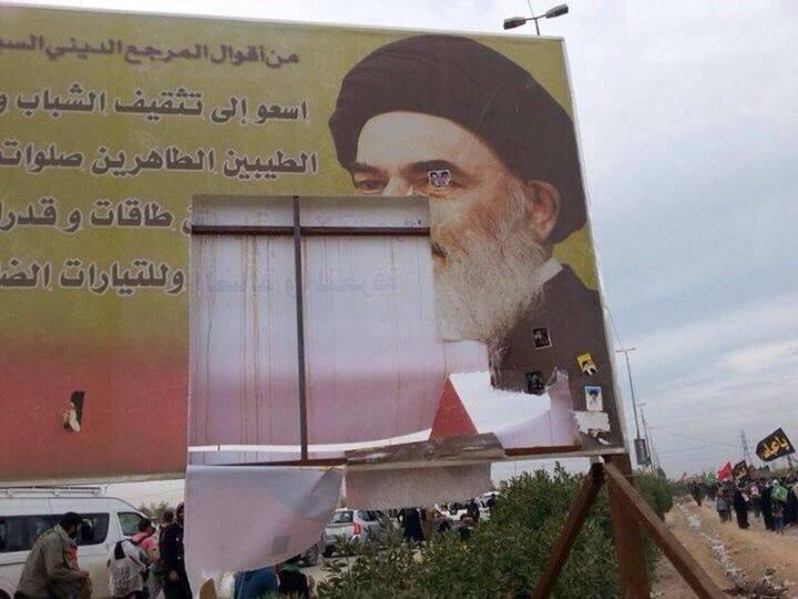 ripped banner of Ayatollah Seyed Sadeq Shirazi 