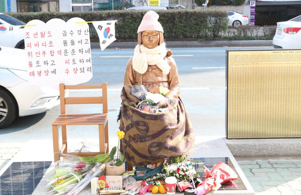 comfort woman statue outside the Japanese consulate in Busan, South Korea