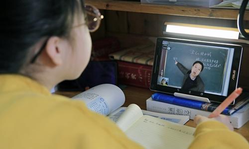 student takes an online course at home in China