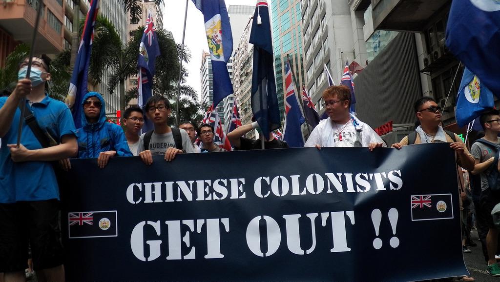 pro-independence protestors carry colonial Hong Kong flags, July 2013