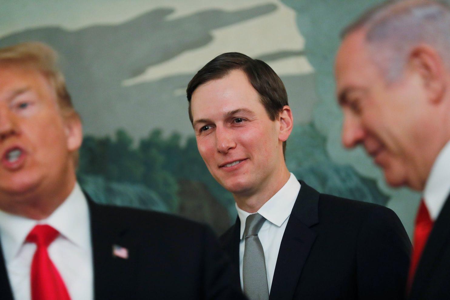 Jared Kushner smiles with Benjamin Netanyahu while Donald Trump faces reporters