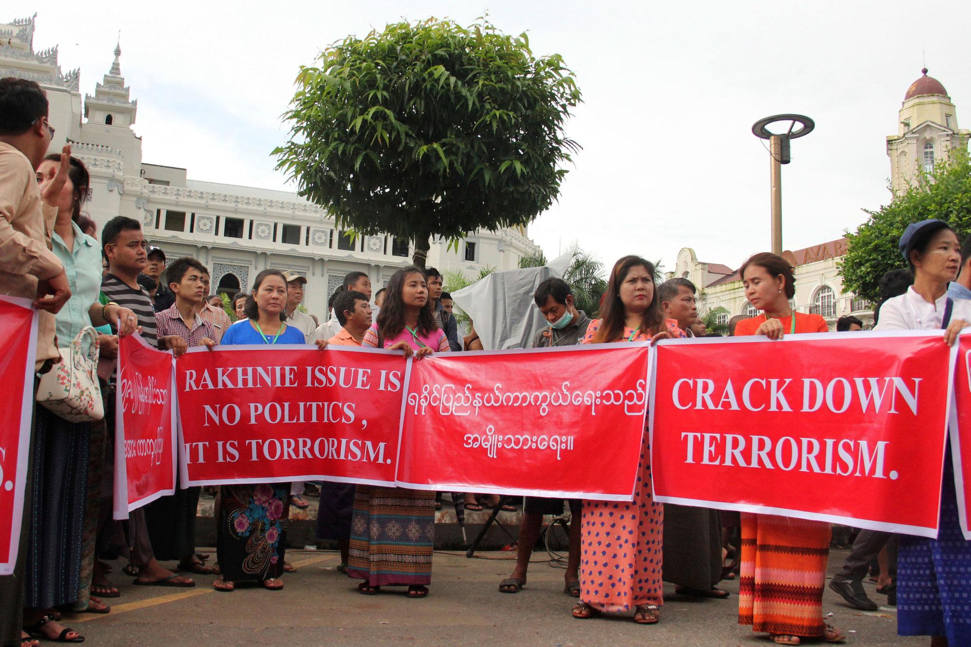 protestors in Yangon with banner proclaiming Rakhine (Rohingya) crisis as issue of terrorism