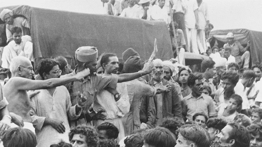 Gandhi visits Muslims awaiting transportation to Pakistan, September 27, 1947