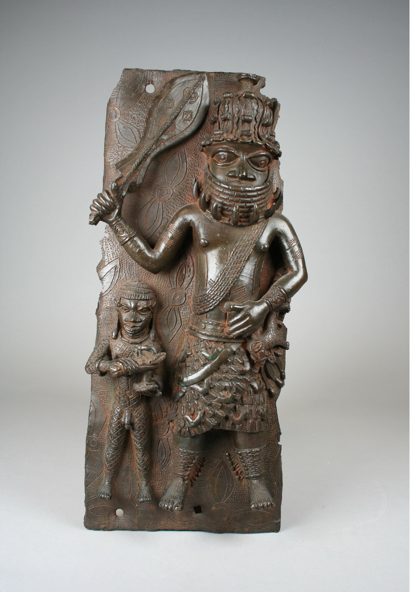 Ìgùn Ẹ́rọ̀nwwọ̀n (brass-casting guild) artists, Plaque with Ìyàsẹ́ (Royal Commander) and Attendant, ca. 1540–70. Metropolitan Museum of Art.