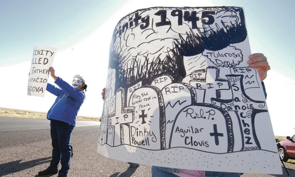 protesters with signs outside White Sands Missile Range, 2011