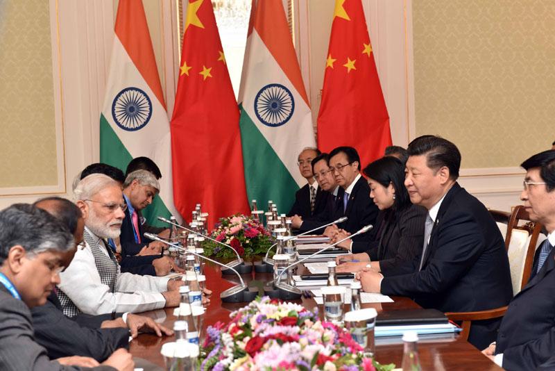 Indian Prime Minister Narendra Modi meets President Xi Jinping of China on the sidelines of the 2016 SCO Meeting in Tashkent