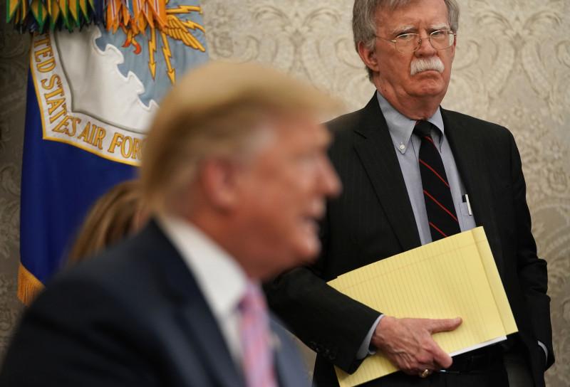 John Bolton listens to Trump in the Oval Office, April 2019