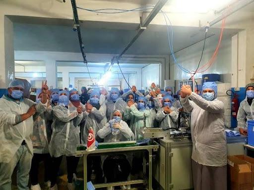 Around 150 workers, mostly women, self-isolate to produce protective equipment for healthcare workers at the Consomed factory in rural Tunisia
