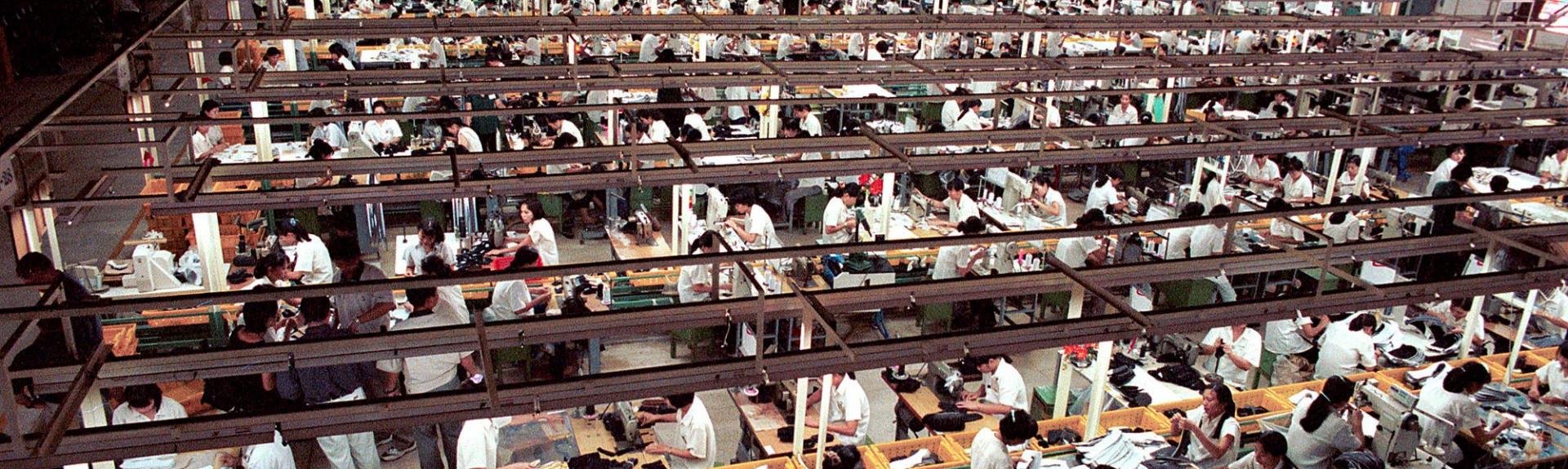 Hundreds of Asian workers in a sweatshop