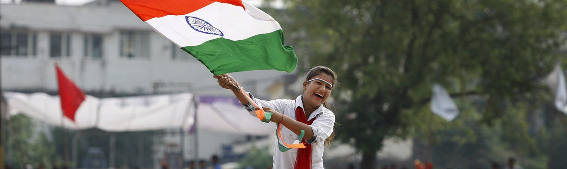 person holding the indian flag