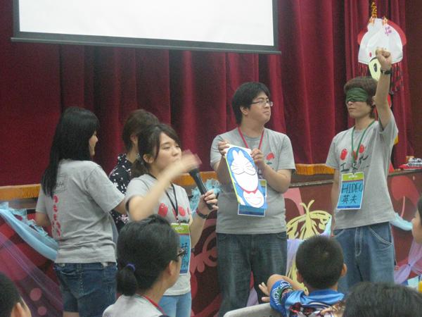 Tama University students teach a game at Rui-bin Camp, 2014