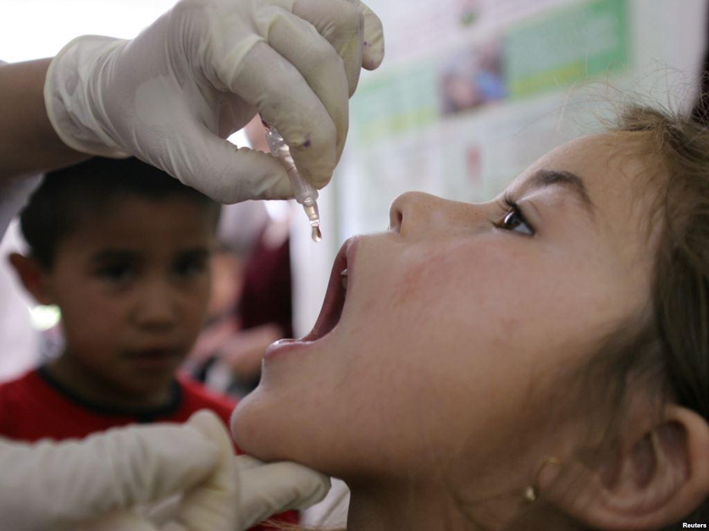 a child receives a polio vaccination