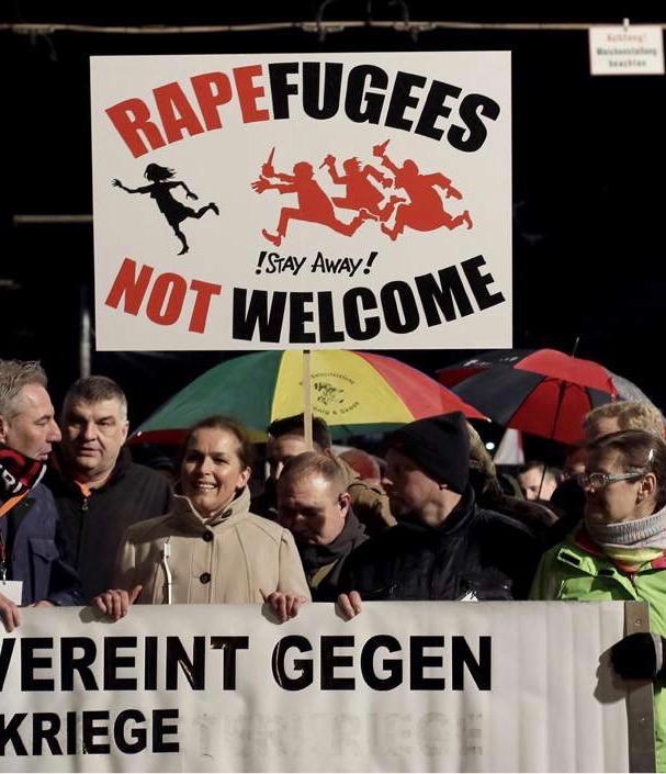 protestors in Leipzig, Germany hold sign reading 'Rapefugees Not Welcome' - January 2016