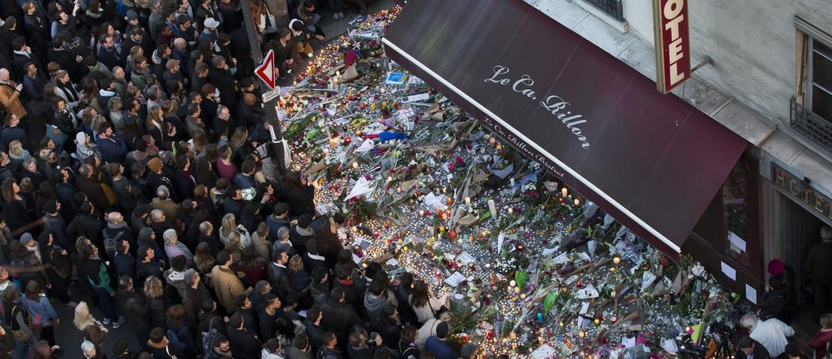 Paris, crowd leave flowers at memorial to attack victims, Ca Rillon Restarurant, November 2016.