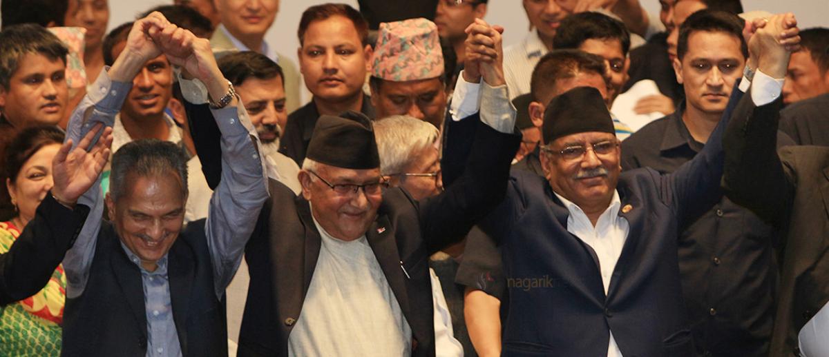 UML chair KP Sharma Oli, MC chair Pushpa Kamal Dahal, and Naya Shakti party coordinator Babu Ram Bhattarai celebrate unification