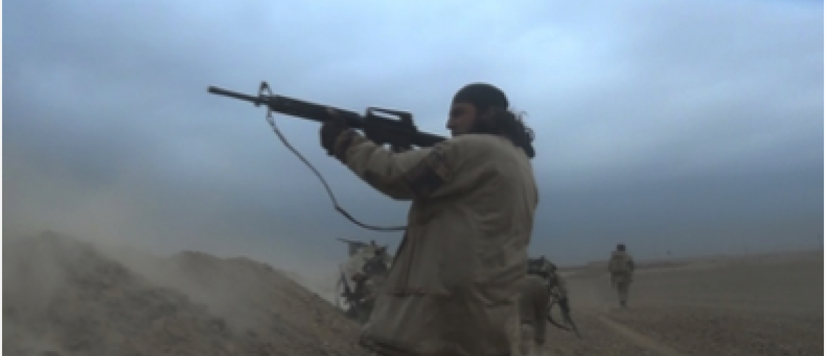Daesh fighter firing machine gun in battle