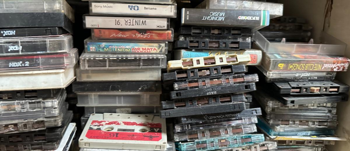 Shelf of cassette tapes in a public market in Surakarta | Photo by David Novak