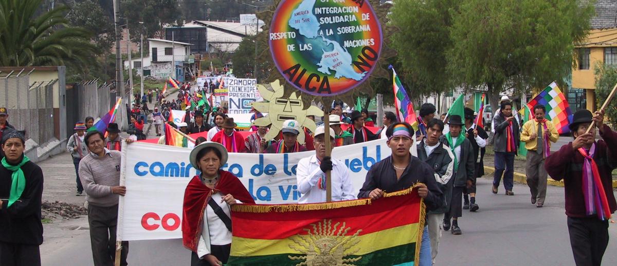 CONAIE march with flag in Quito, Ecuador