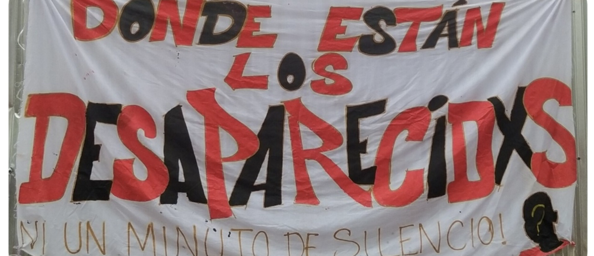 A photograph of the banner at the monthly meeting asks: Where are the Disappeared?. Photo by Fundación Guagua, used with permission