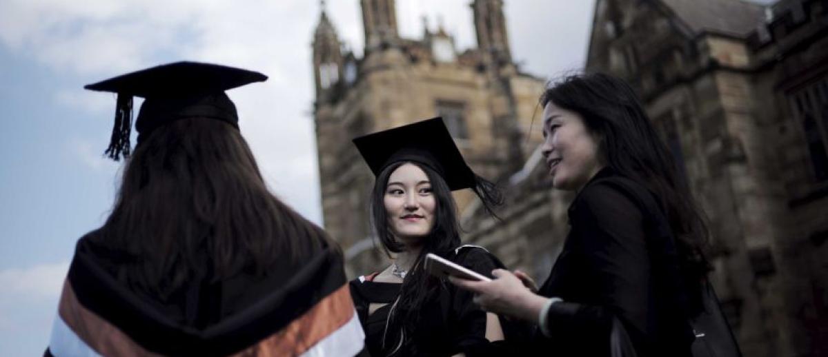 Chinese graduates in robes at the University of Sydney