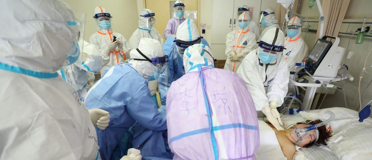 Medical staff care for a critically ill COVID-19 patient at a hospital in Wuhan, China