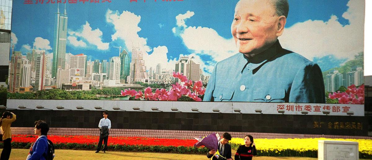 people take pictures at Deng Xiaoping mural-poster in Shenzhen, China