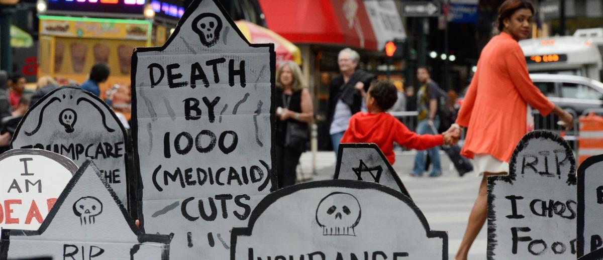 healthcare protest with mock gravestones, New York, June 2017