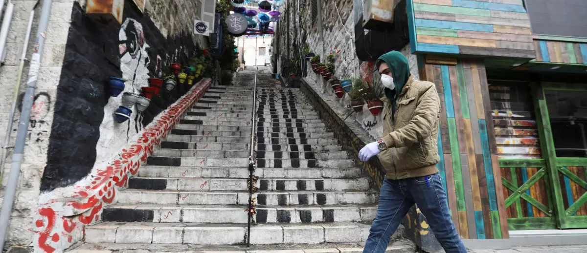 An individual strolling through Amman, Jordan, home to the majority of the country's nearly one million displaced individuals. 