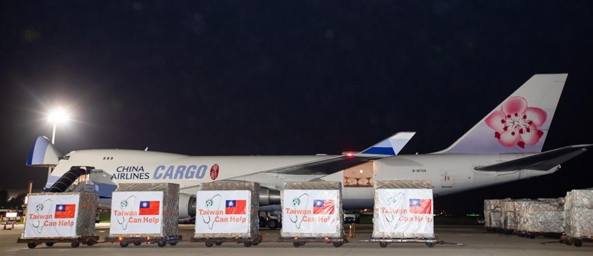 several palettes of face masks in front of China Airlines Cargo 747.